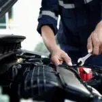 Mechanic Repairing Car