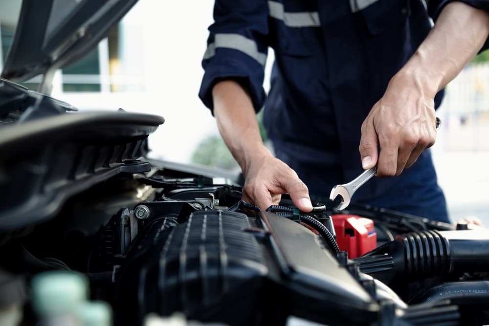 Mechanic Repairing Car